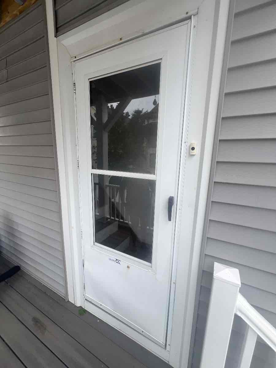 One of six storm doors we quoted for replacement on a single Boston two-family.